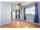 Bedroom with wood laminate floors, neutral paint, closet, and large windows with curtains at 16629 E Westby Dr, Fountain Hills, AZ 85268