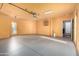 Spacious garage with overhead lighting and two entry doors at 16629 E Westby Dr, Fountain Hills, AZ 85268