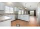 Bright kitchen featuring white cabinets, stone countertops, and modern appliances at 16629 E Westby Dr, Fountain Hills, AZ 85268