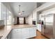 Open concept kitchen with stainless steel appliances and granite countertops, perfect for entertaining guests and Gathering at 16629 E Westby Dr, Fountain Hills, AZ 85268