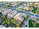 Aerial view of a light roofed single Gathering house in a lush, landscaped Arizona neighborhood at 1697 E Tangelo Pl, Queen Creek, AZ 85140