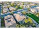 Light colored roof of an upscale home in a golf course community in Arizona surrounded by desert landscape at 1697 E Tangelo Pl, Queen Creek, AZ 85140