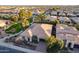 Lush trees dot this neighborhood showcasing the light-roofed single Gathering homes with desert landscaping at 1697 E Tangelo Pl, Queen Creek, AZ 85140