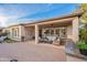 Comfortable covered patio with ceiling fan and outdoor seating area at 1697 E Tangelo Pl, Queen Creek, AZ 85140