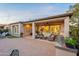 Comfortable back porch offers a relaxing seating area, BBQ, and well-manicured yard space at 1697 E Tangelo Pl, Queen Creek, AZ 85140