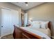 Comfortable bedroom features ample closet space and warm, inviting decor at 1697 E Tangelo Pl, Queen Creek, AZ 85140