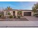 Charming single-story home featuring desert landscaping and inviting front entry, with a convenient attached garage at 1697 E Tangelo Pl, Queen Creek, AZ 85140