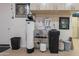 Garage interior featuring water filtration system, clock, storage cabinets, and a durable epoxy floor at 1697 E Tangelo Pl, Queen Creek, AZ 85140