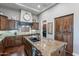 Beautiful kitchen featuring a large island, wooden cabinets, and modern appliances at 1697 E Tangelo Pl, Queen Creek, AZ 85140