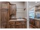 Functional laundry room with custom cabinets and sink; convenient and practical at 1697 E Tangelo Pl, Queen Creek, AZ 85140