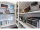 Organized walk-in pantry with ample shelving for storage and small appliances at 1697 E Tangelo Pl, Queen Creek, AZ 85140