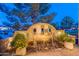 Striking water feature illuminated at night, enhancing the beauty of the outdoor space at 1697 E Tangelo Pl, Queen Creek, AZ 85140