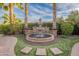 Attractive water fountain with detailed stonework and lush landscaping at 1697 E Tangelo Pl, Queen Creek, AZ 85140