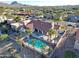 Aerial view of the home with a pool, outdoor seating, and desert landscaping against a mountain backdrop at 17104 E Rand Dr, Fountain Hills, AZ 85268