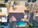 Aerial view of backyard featuring a pool, fire pit, lounge area, and lush desert landscaping at 17104 E Rand Dr, Fountain Hills, AZ 85268