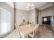 Cozy dining room with light-colored furniture, bathed in natural light from a large window, perfect for intimate meals at 17104 E Rand Dr, Fountain Hills, AZ 85268