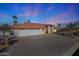 Exterior view of home featuring an expansive driveway and a three-car garage at 17104 E Rand Dr, Fountain Hills, AZ 85268