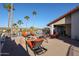 Expansive patio featuring a fire pit, lounge chairs, and a swing, perfect for outdoor relaxation and entertaining at 17104 E Rand Dr, Fountain Hills, AZ 85268