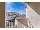 Balcony view of the neighborhood, showcasing the community's architecture and well-maintained surroundings under a clear sky at 1750 E Ocotillo Rd # 11, Phoenix, AZ 85016