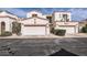 Charming multi-unit building showing well-manicured landscaping, garage doors and red terracotta roofing at 1750 E Ocotillo Rd # 11, Phoenix, AZ 85016