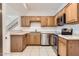 Well-lit kitchen with stainless steel appliances and light wood cabinets at 1750 E Ocotillo Rd # 11, Phoenix, AZ 85016