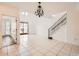 Bright and airy living room featuring staircase and glass doors leading to outdoor space at 1750 E Ocotillo Rd # 11, Phoenix, AZ 85016