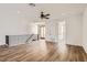 Bright living room with wood floors, ceiling fan, iron railing, and an abundance of natural light at 1750 E Ocotillo Rd # 11, Phoenix, AZ 85016