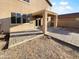 Backyard space with covered patio, brick pavers, and potential for landscaping and outdoor enjoyment at 17699 W Tonto St, Goodyear, AZ 85338