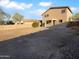 Expansive backyard with a block fence and partial covered patio at 17699 W Tonto St, Goodyear, AZ 85338