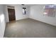 Entryway leading into a spacious room, featuring carpeting at 17699 W Tonto St, Goodyear, AZ 85338