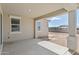 Covered patio features concrete flooring, view of the backyard, and is well-lit at 17712 W Hatcher Rd, Waddell, AZ 85355