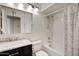 Bathroom with granite counters, modern fixtures, and tiled shower-tub combo at 1812 W Curry Drive Dr, Chandler, AZ 85224