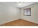 Bedroom with light wood floors and a window with neutral blinds at 1812 W Curry Drive Dr, Chandler, AZ 85224