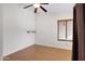 A simple bedroom with hardwood flooring and a window with blinds at 1812 W Curry Drive Dr, Chandler, AZ 85224