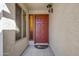 Close-up of home's entryway with a decorative light fixture and a multi-paneled front door at 1812 W Curry Drive Dr, Chandler, AZ 85224