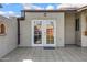 Charming exterior doorway with glass paneled doors leading to the backyard patio at 1812 W Curry Drive Dr, Chandler, AZ 85224