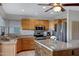 A modern kitchen with stainless steel appliances and a central island with a granite countertop at 1812 W Curry Drive Dr, Chandler, AZ 85224