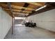 Unfinished storage space with exposed beams, concrete flooring, and potential for customization at 1812 W Curry Drive Dr, Chandler, AZ 85224