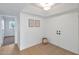 Hallway with double doors, wood floors, and natural lighting at 18811 N 19Th Ave # 2025, Phoenix, AZ 85027