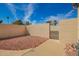 Low maintenance backyard with gravel landscaping, secure block fencing, and a desert landscape at 19802 N Greenview Dr, Sun City West, AZ 85375