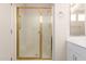 A bathroom featuring a glass-door shower, a vanity with a sink, and neutral color palette at 19802 N Greenview Dr, Sun City West, AZ 85375