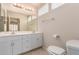 A well-lit bathroom featuring a double sink vanity and ample storage space at 19802 N Greenview Dr, Sun City West, AZ 85375