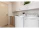 A well-organized laundry room with modern appliances and ample storage space at 19802 N Greenview Dr, Sun City West, AZ 85375