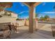 Inviting front porch with seating area and a view of the desert street at 19802 N Greenview Dr, Sun City West, AZ 85375