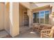 Inviting front porch with seating area, offering a cozy spot to relax by the front door at 19802 N Greenview Dr, Sun City West, AZ 85375