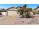 Charming single-story home featuring a two car garage and low maintenance desert landscaping at 19930 N 98Th Ave, Peoria, AZ 85382