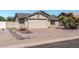 Charming single-story home featuring a two car garage and low maintenance desert landscaping at 19930 N 98Th Ave, Peoria, AZ 85382