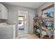 Pantry with storage shelving, leading to the garage at 19930 N 98Th Ave, Peoria, AZ 85382