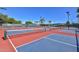 Active pickleball courts with nets and vibrant blue and red playing surfaces under a sunny sky at 19930 N 98Th Ave, Peoria, AZ 85382