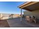 Inviting backyard patio with a view of the sparkling pool, perfect for outdoor entertaining at 221 N 151St Ave, Goodyear, AZ 85338